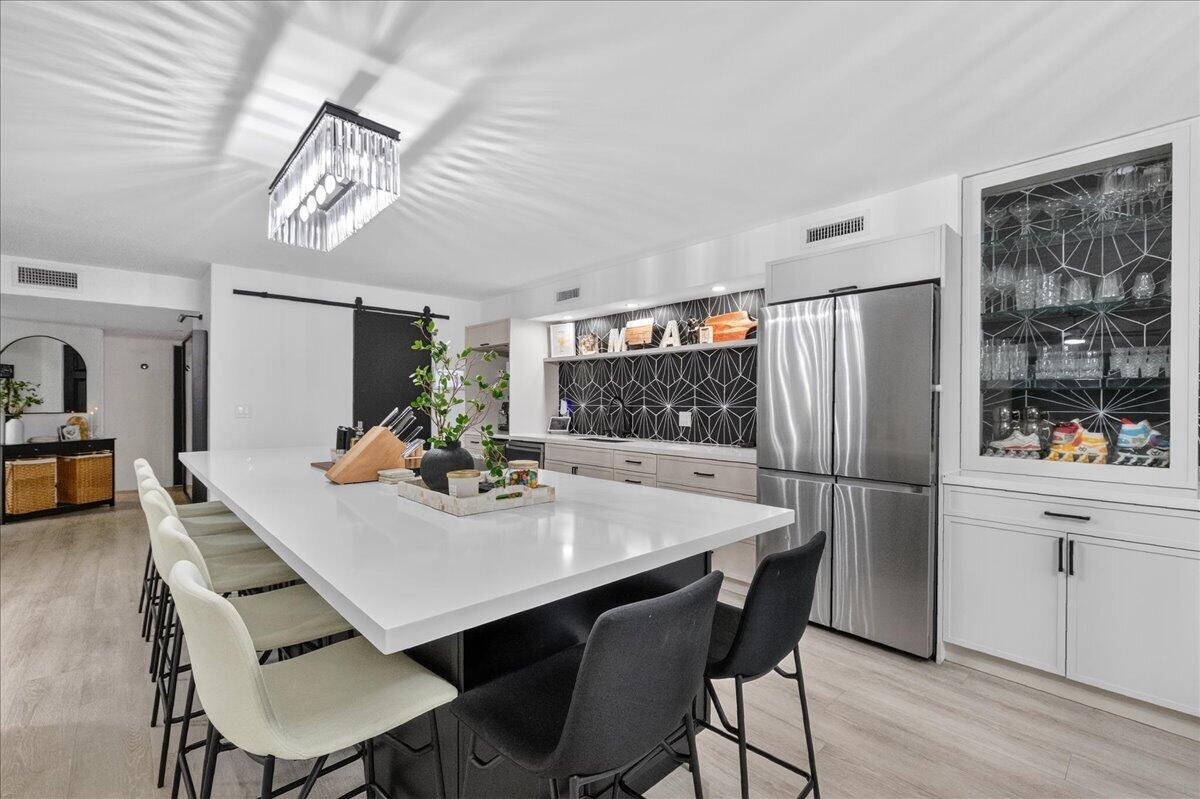 9729 North New River Canal Road, Unit 628 Plantation, FL 33324 - Photo 12 of 50 a view of a dining room with furniture and wooden floor