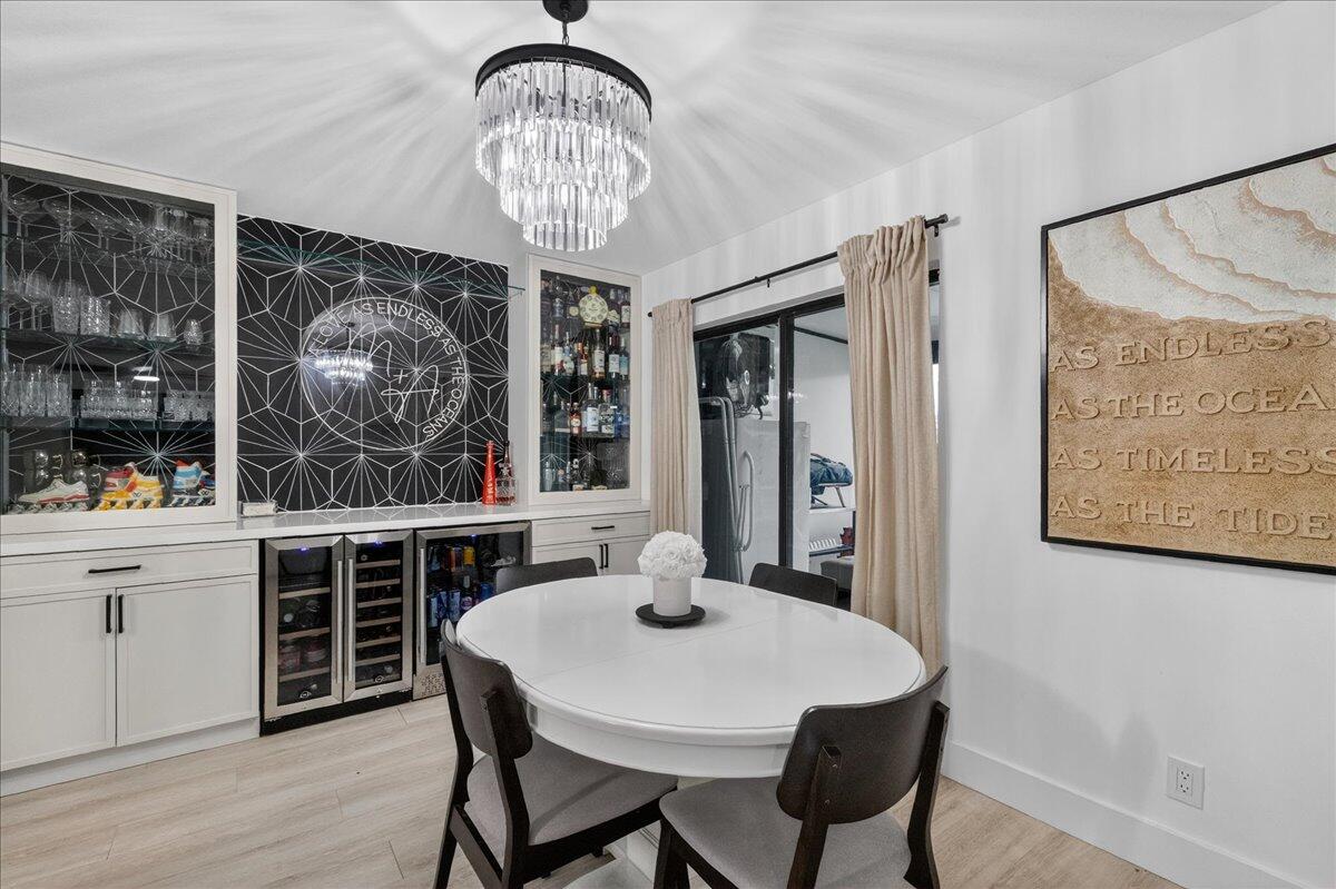9729 North New River Canal Road, Unit 628 Plantation, FL 33324 - Photo 14 of 50 a view of a dining room with furniture window and wooden floor