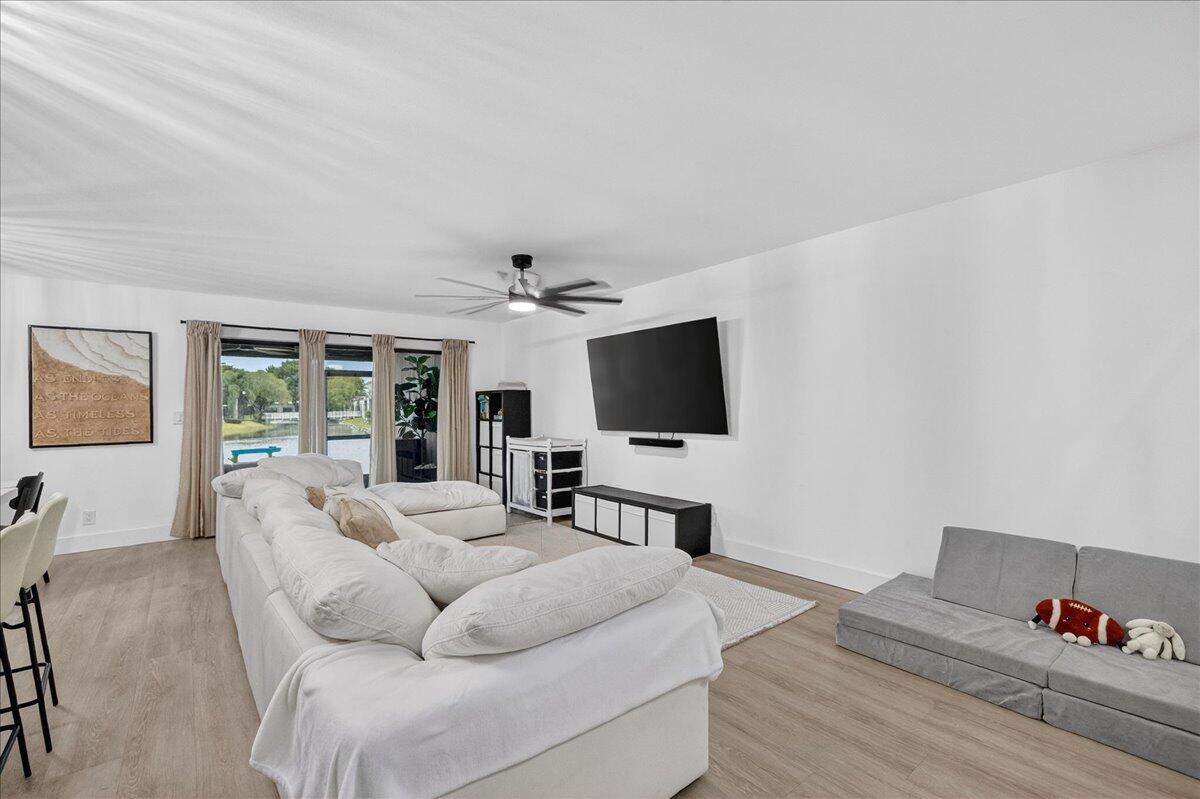 9729 North New River Canal Road, Unit 628 Plantation, FL 33324 - Photo 15 of 50 a living room with furniture and a flat screen tv