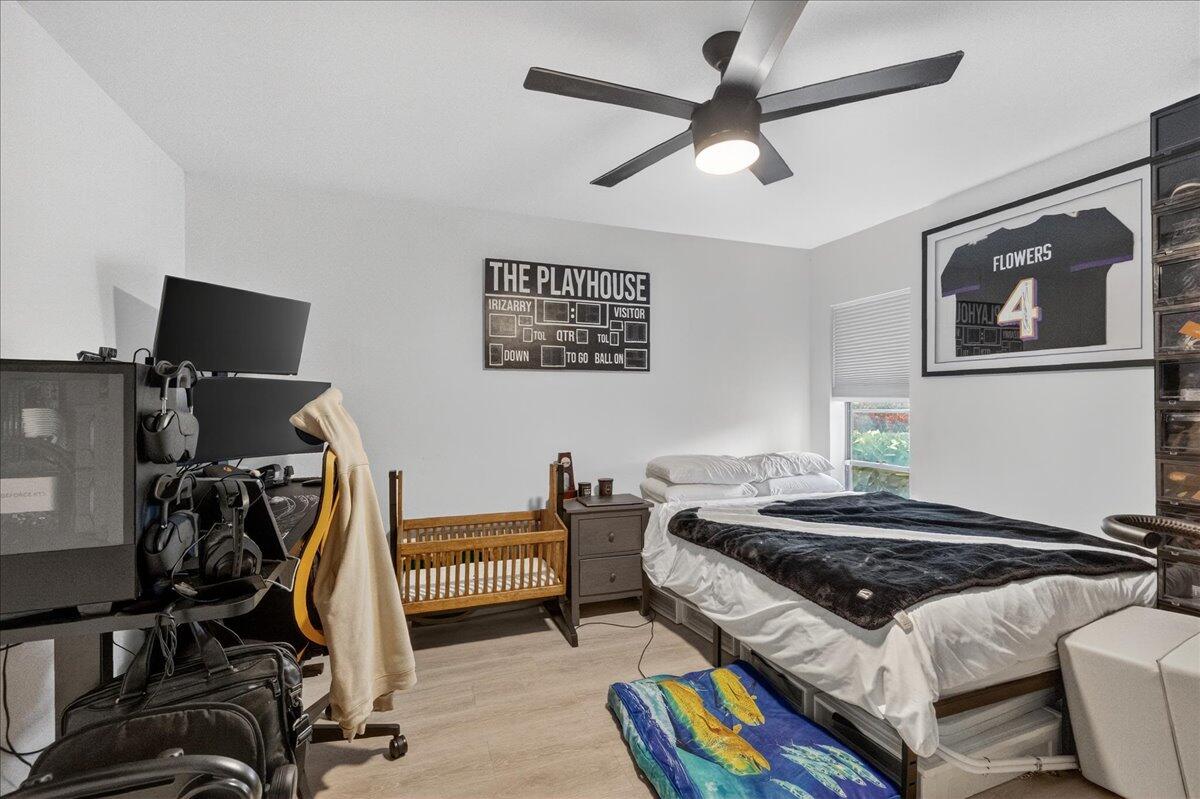 9729 North New River Canal Road, Unit 628 Plantation, FL 33324 - Photo 17 of 50 a bedroom with bed and a flat screen tv