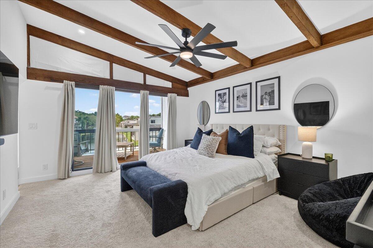 9729 North New River Canal Road, Unit 628 Plantation, FL 33324 - Photo 24 of 50 a spacious bedroom with a bed a mirror and a large window with the outer view