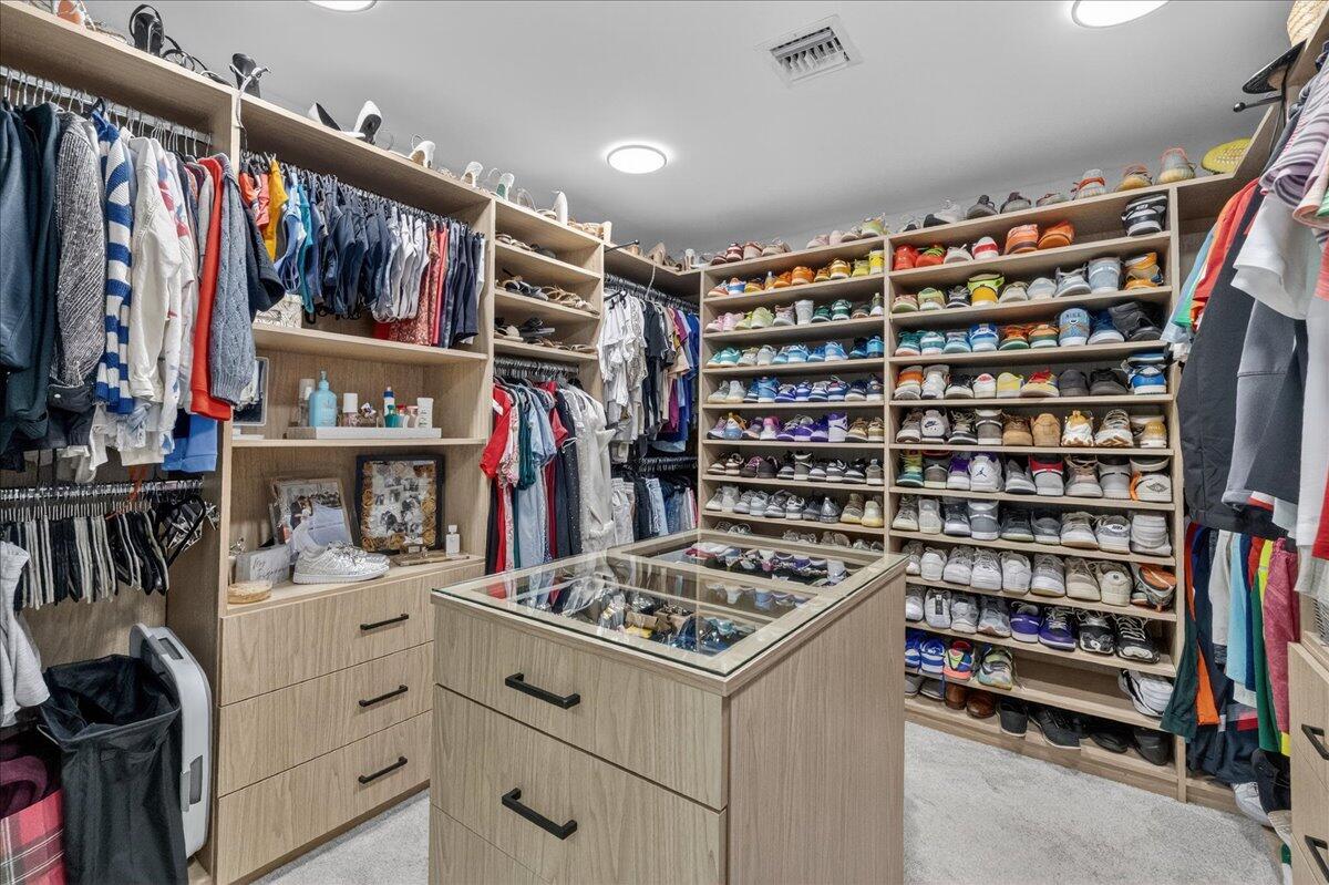 9729 North New River Canal Road, Unit 628 Plantation, FL 33324 - Photo 27 of 50 a view of walk in closet with clothes and shoes