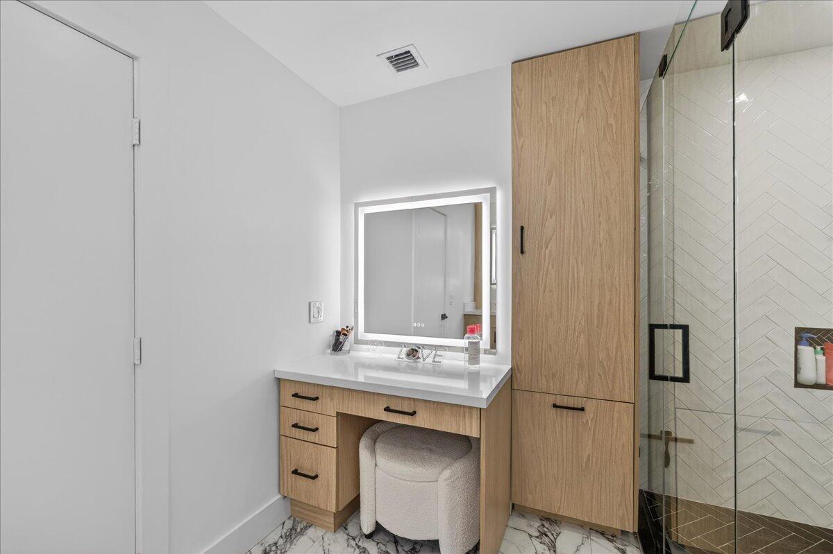 9729 North New River Canal Road, Unit 628 Plantation, FL 33324 - Photo 30 of 50 a bathroom with a sink and a mirror