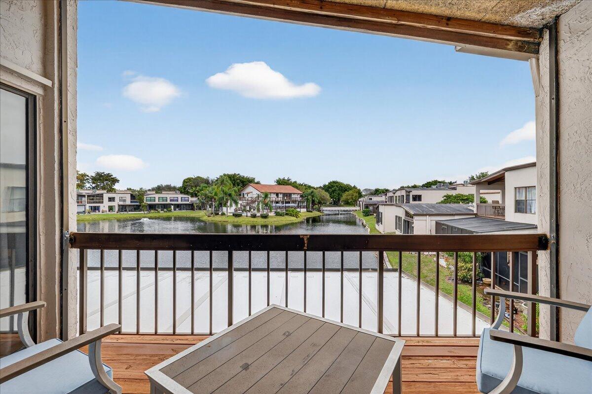 9729 North New River Canal Road, Unit 628 Plantation, FL 33324 - Photo 32 of 50 a view of a balcony with wooden floor