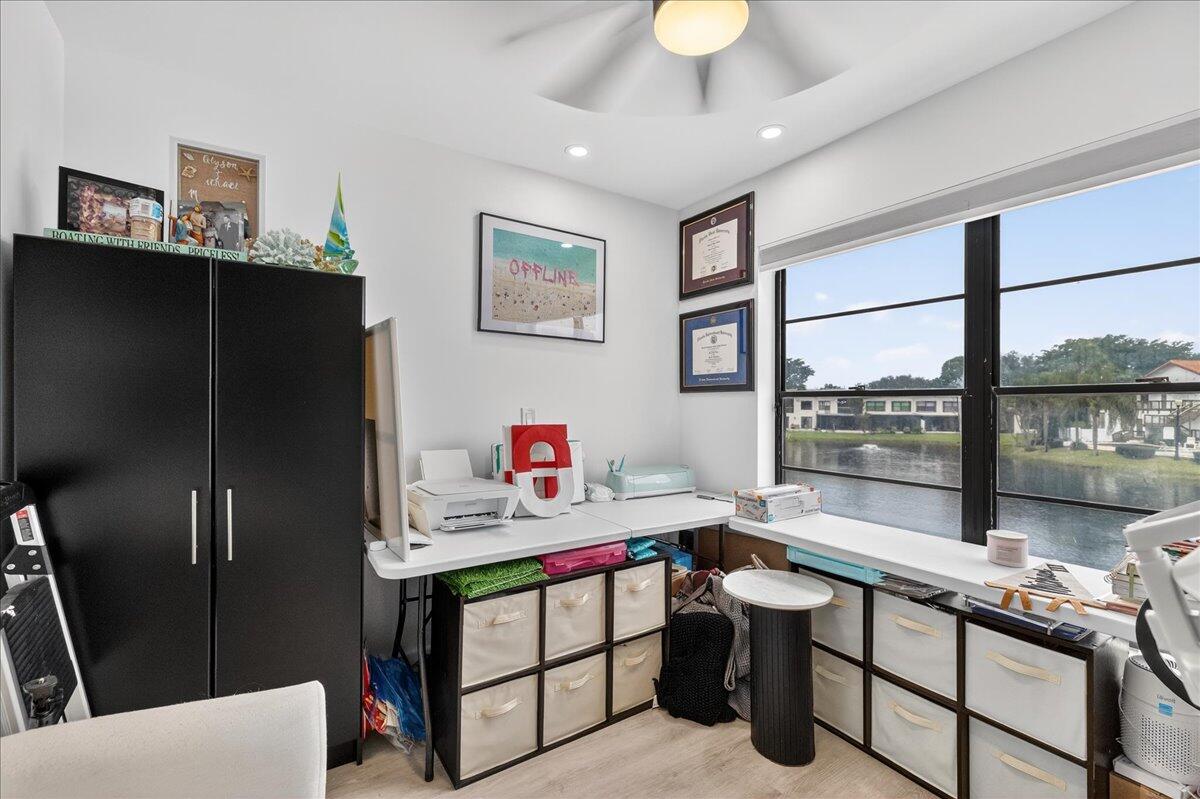 9729 North New River Canal Road, Unit 628 Plantation, FL 33324 - Photo 34 of 50 a room with furniture a large window and a chandelier