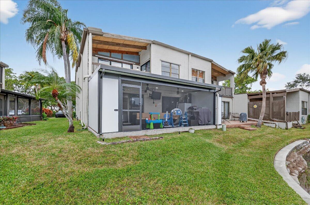 9729 North New River Canal Road, Unit 628 Plantation, FL 33324 - Photo 38 of 50 a view of a house with a yard and sitting area