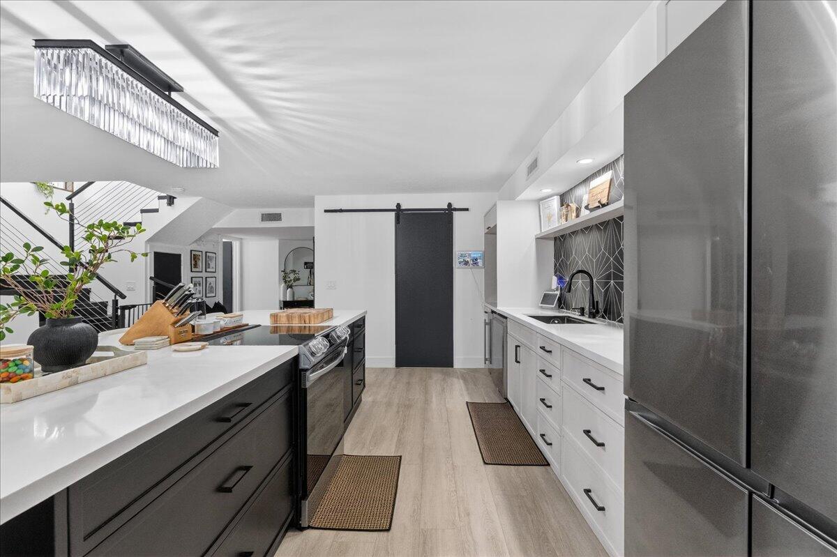 9729 North New River Canal Road, Unit 628 Plantation, FL 33324 - Photo 9 of 50 a kitchen with a sink and cabinets