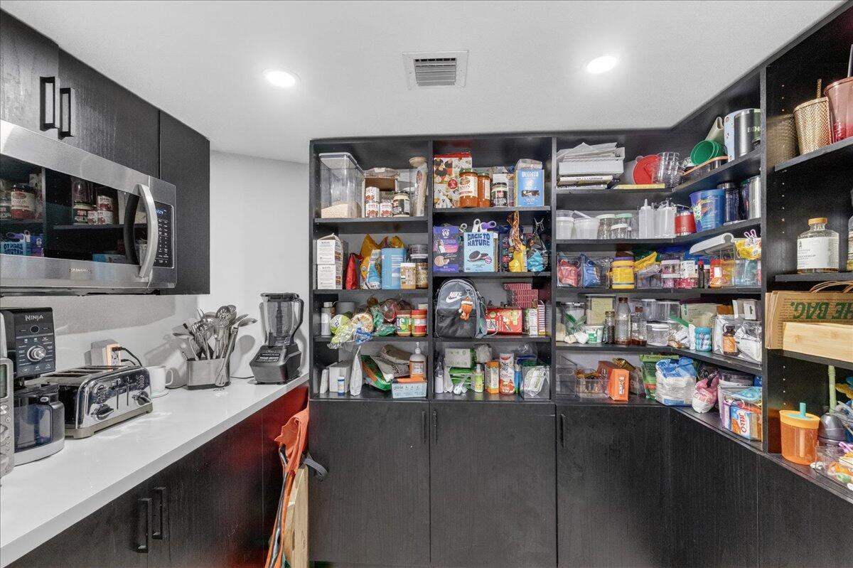 9729 North New River Canal Road, Unit 628 Plantation, FL 33324 - Photo 10 of 50 a room with lots of bottles of alcohol