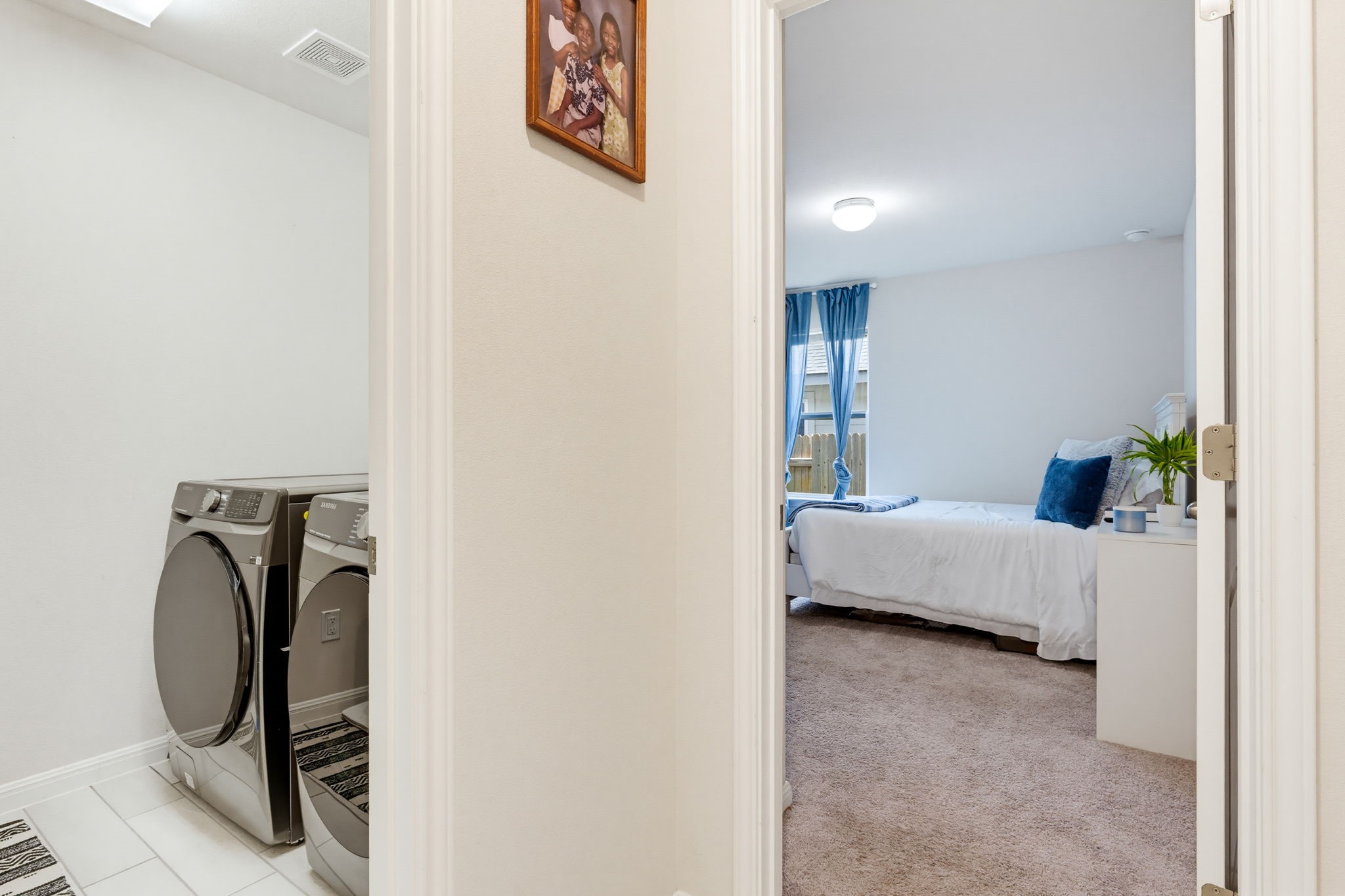 316 Windstar Road Liberty Hill, TX 78642 - Photo 24 of 27 a bedroom with a bed and a chair in it