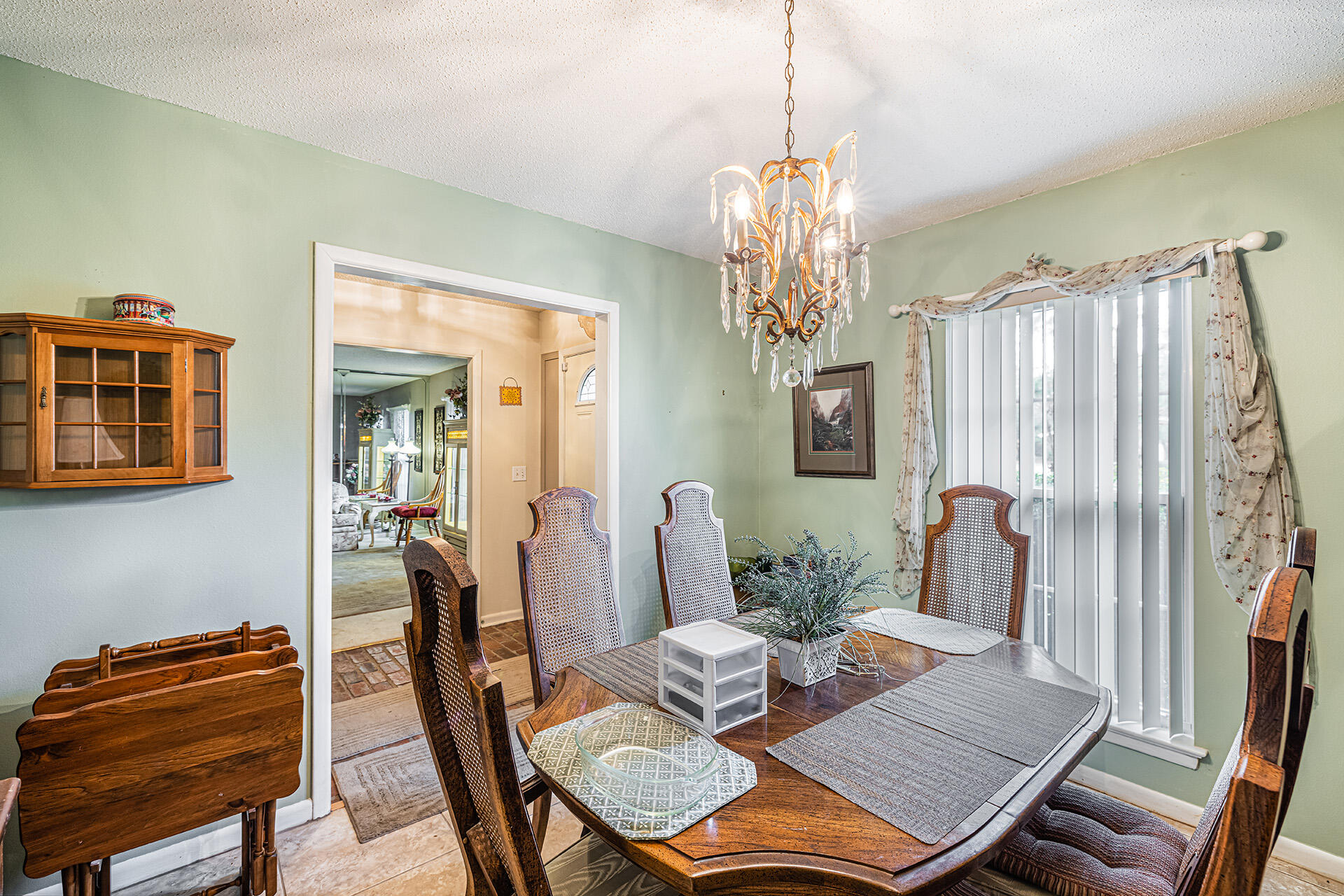 81 Country Club Road Shalimar, FL 32579 - Photo 17 of 31 a view of a dining room with furniture and chandelier