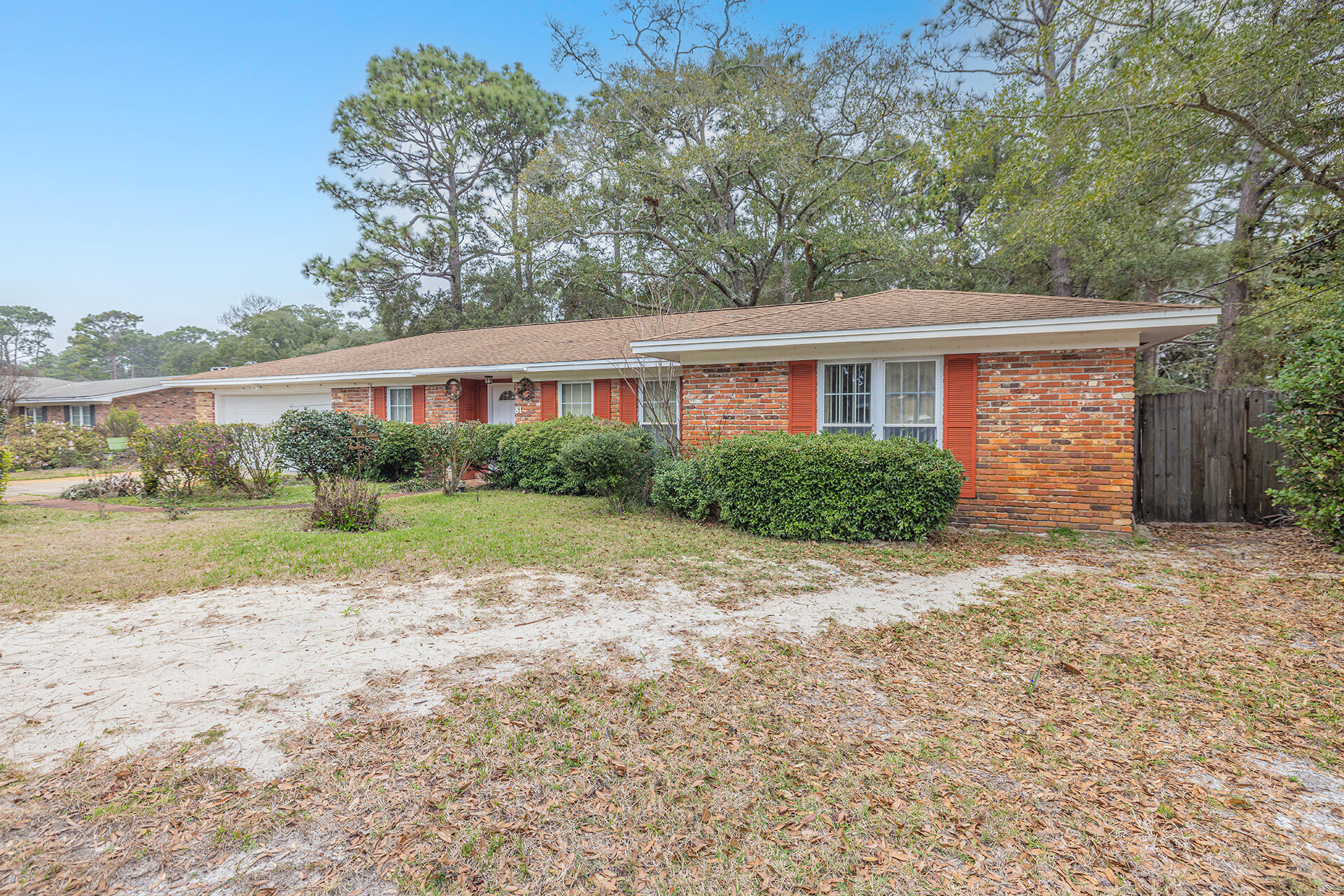 81 Country Club Road Shalimar, FL 32579 - Photo 2 of 31 a view of backyard of house