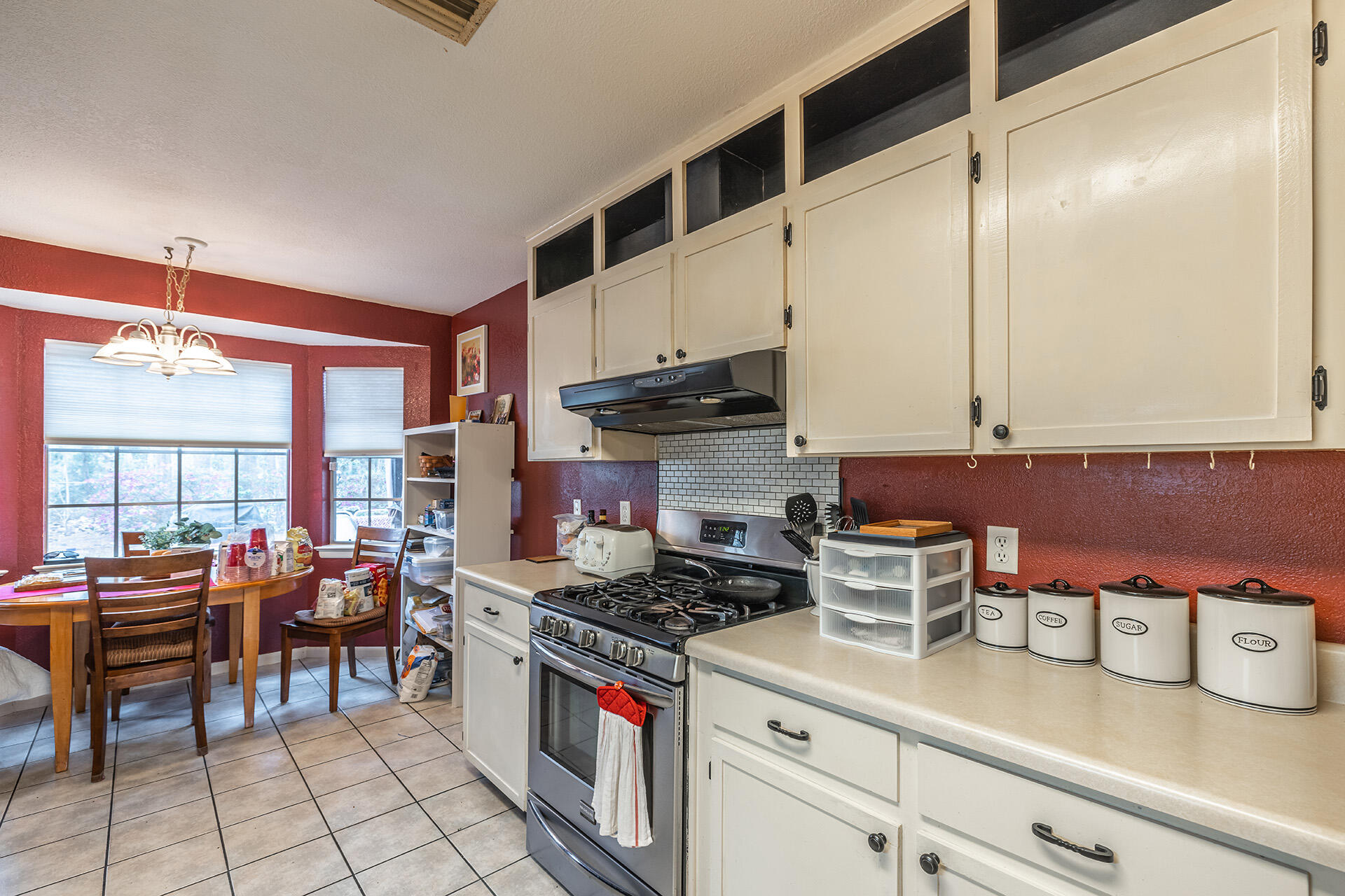81 Country Club Road Shalimar, FL 32579 - Photo 21 of 31 a kitchen with sink cabinets and stove top oven