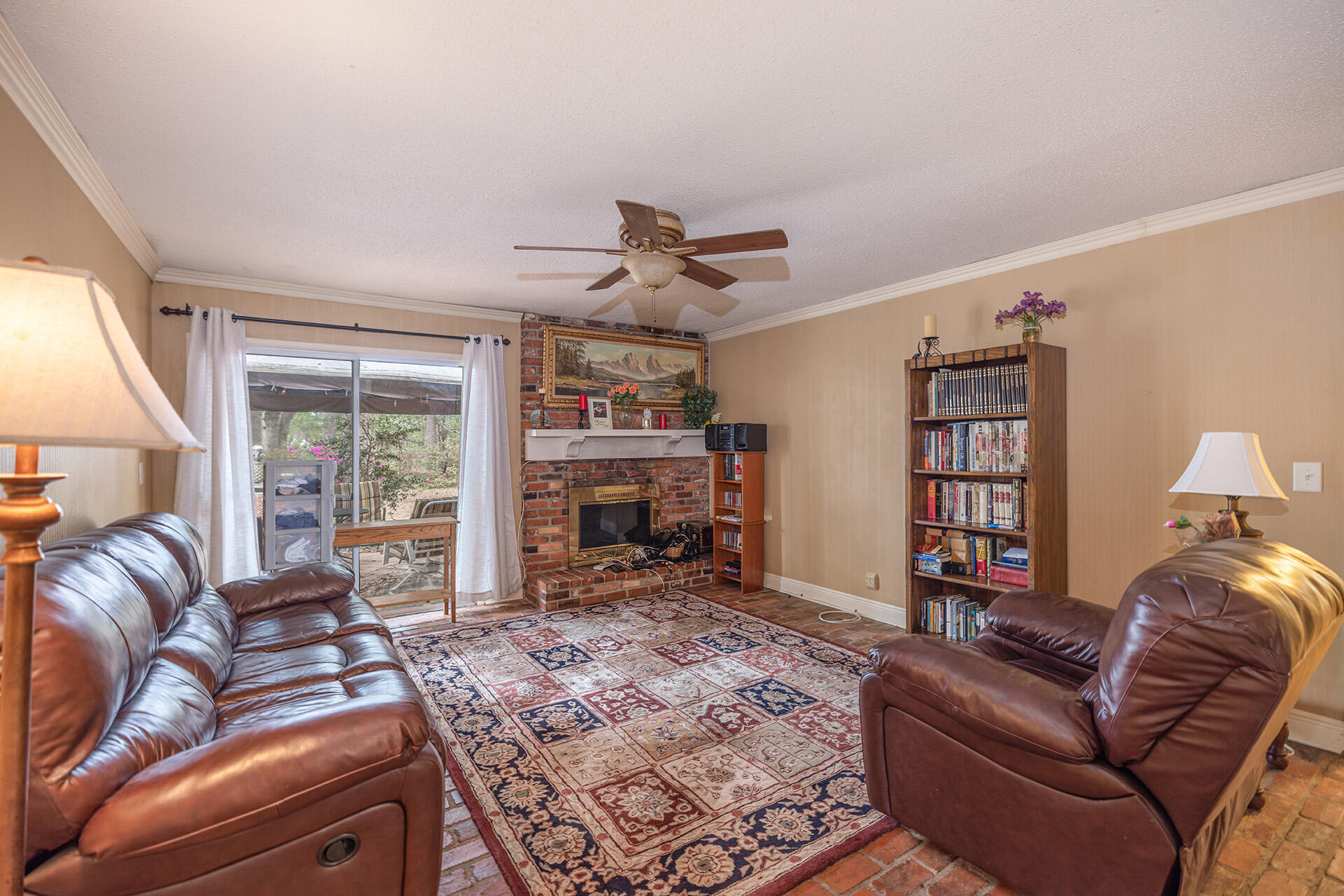 81 Country Club Road Shalimar, FL 32579 - Photo 23 of 31 a living room with furniture a fireplace and a large window