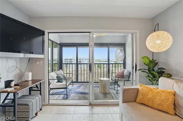 a living room with furniture and a large window