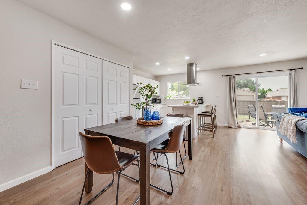 5317 Rutledge Court The Colony, TX 75056 - Photo 13 of 33 a view of a dining room with furniture and wooden floor