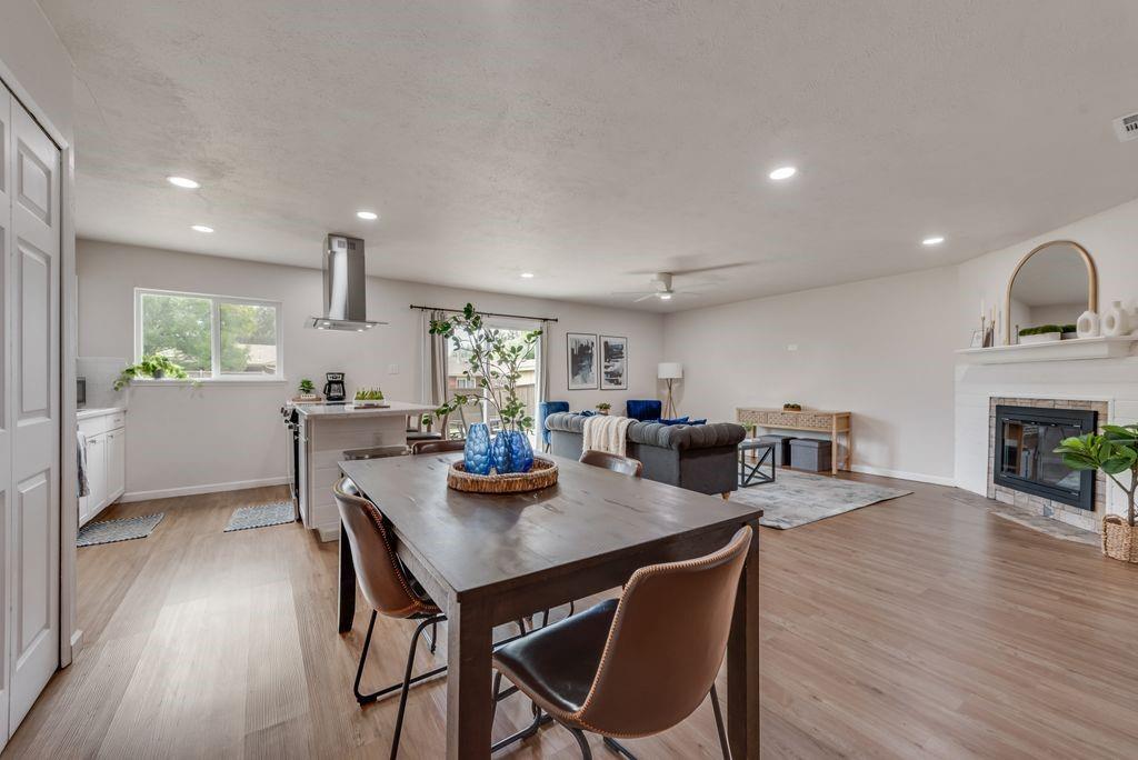 5317 Rutledge Court The Colony, TX 75056 - Photo 14 of 33 a view of a dining room with furniture and wooden floor