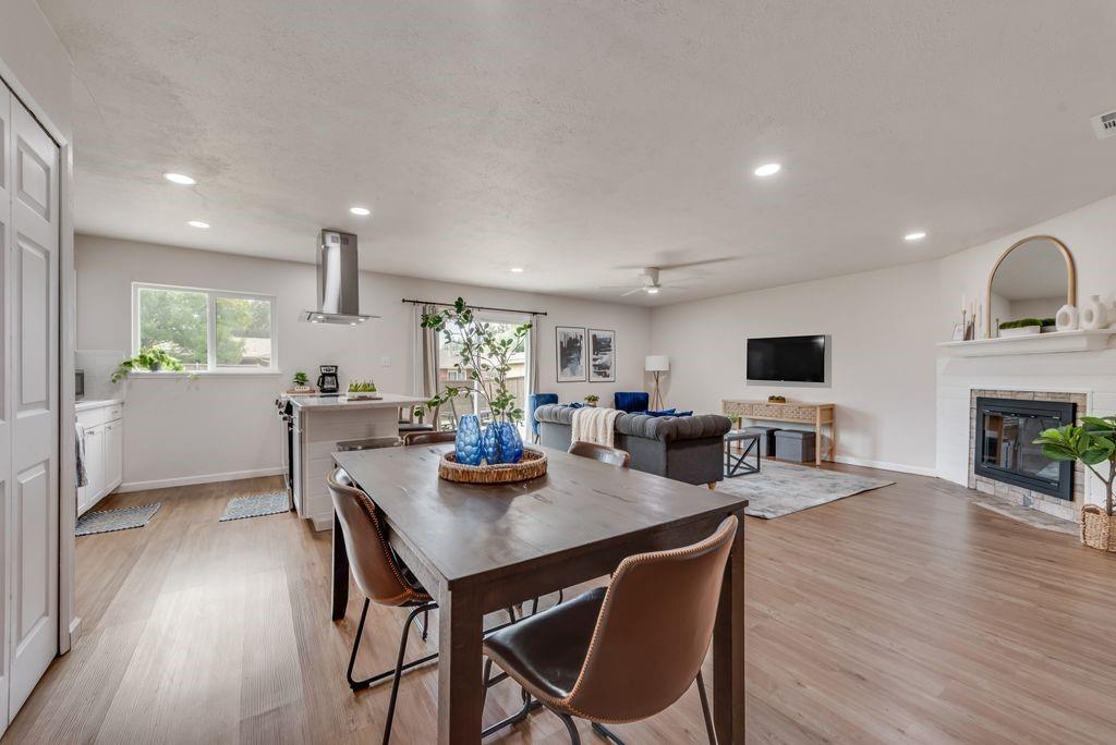 5317 Rutledge Court The Colony, TX 75056 - Photo 15 of 33 a view of a dining room with furniture and wooden floor