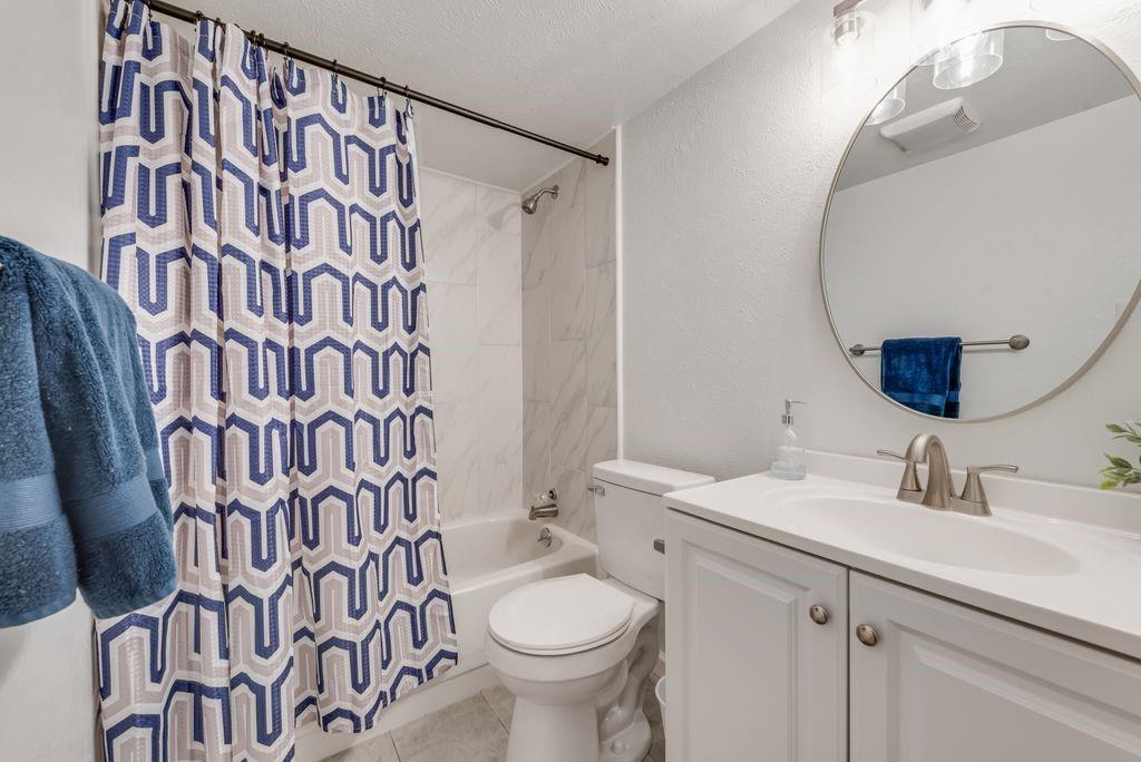 5317 Rutledge Court The Colony, TX 75056 - Photo 25 of 33 a bathroom with a sink and a mirror