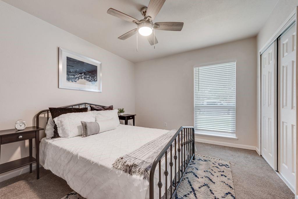 5317 Rutledge Court The Colony, TX 75056 - Photo 27 of 33 a bedroom with beds and a window