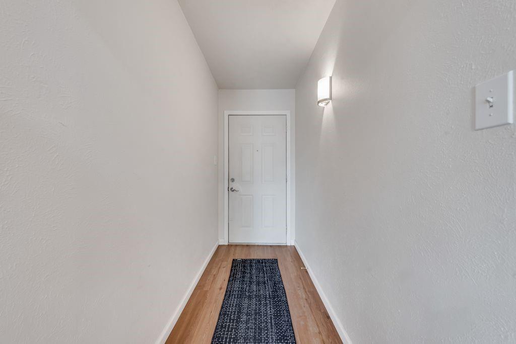 5317 Rutledge Court The Colony, TX 75056 - Photo 7 of 33 a view of a hallway with wooden floor