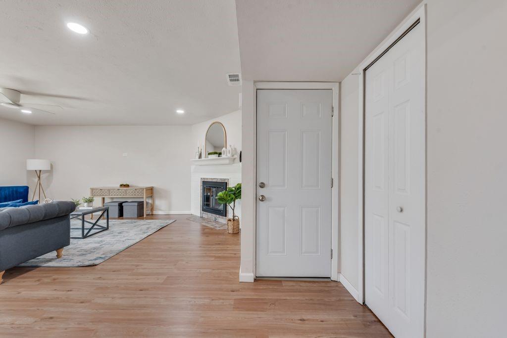 5317 Rutledge Court The Colony, TX 75056 - Photo 8 of 33 a living room with furniture and a wooden floor