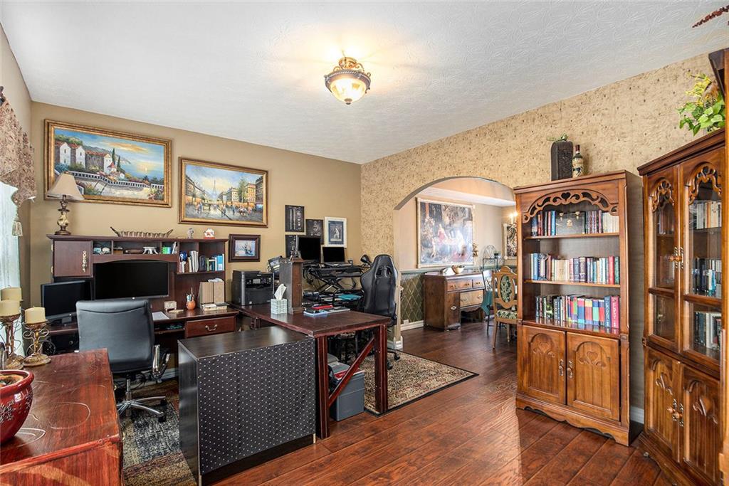 2054 Dartmoth Way Villa Rica, GA 30180 - Photo 15 of 45 a living room with fireplace furniture and a book shelf