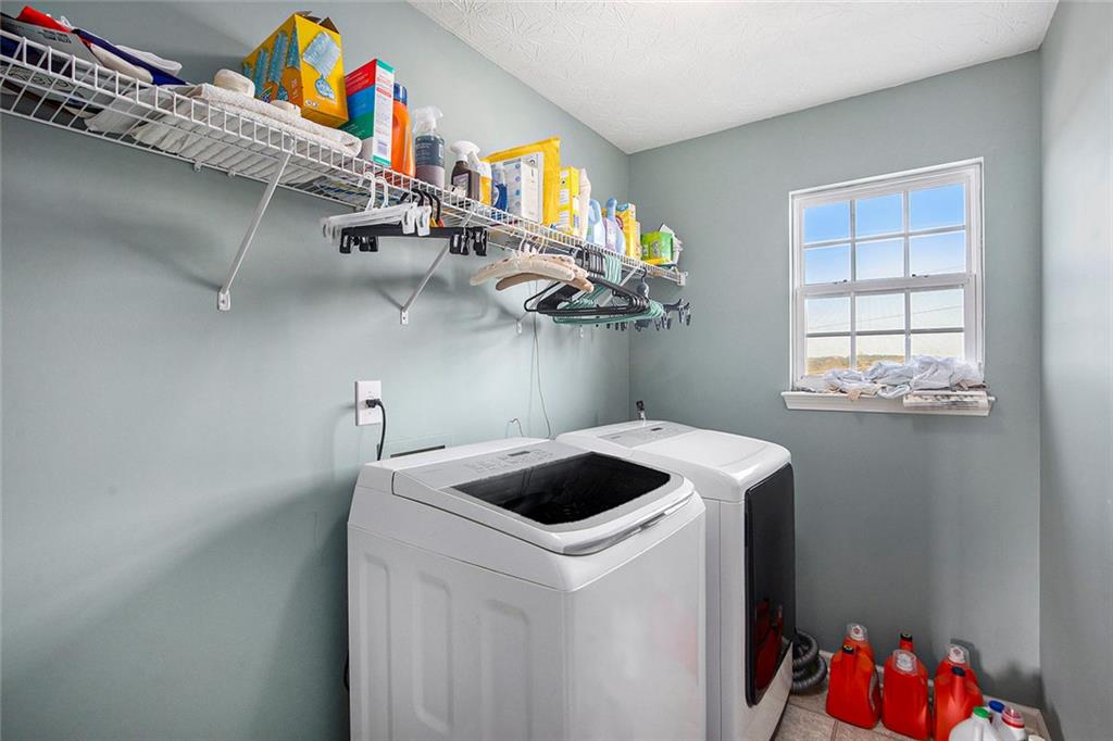 2054 Dartmoth Way Villa Rica, GA 30180 - Photo 17 of 45 a utility room with dryer and washer