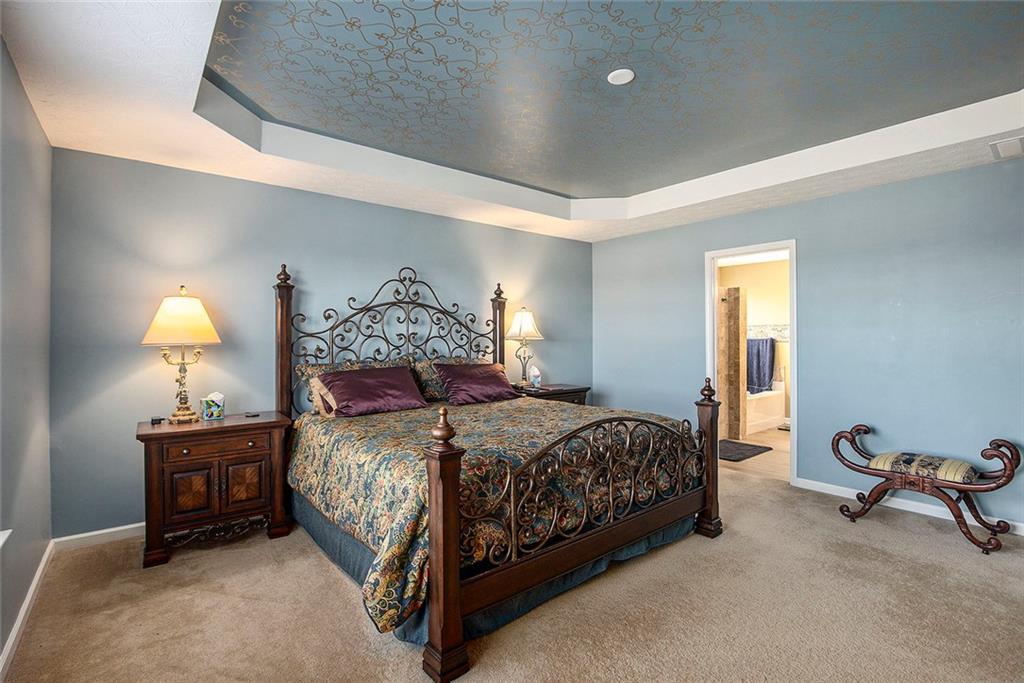 2054 Dartmoth Way Villa Rica, GA 30180 - Photo 19 of 45 a bedroom with a bed and a lamp on table