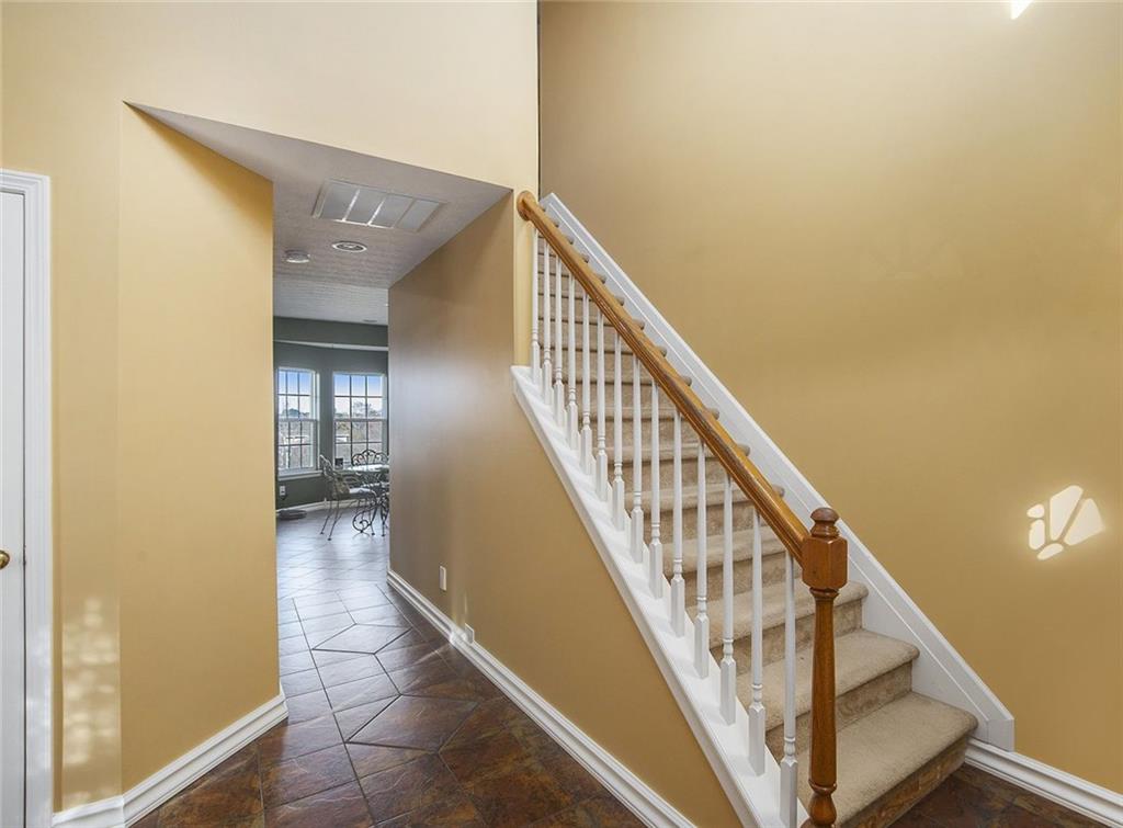 2054 Dartmoth Way Villa Rica, GA 30180 - Photo 2 of 45 a view of a hallway with wooden floor and staircase