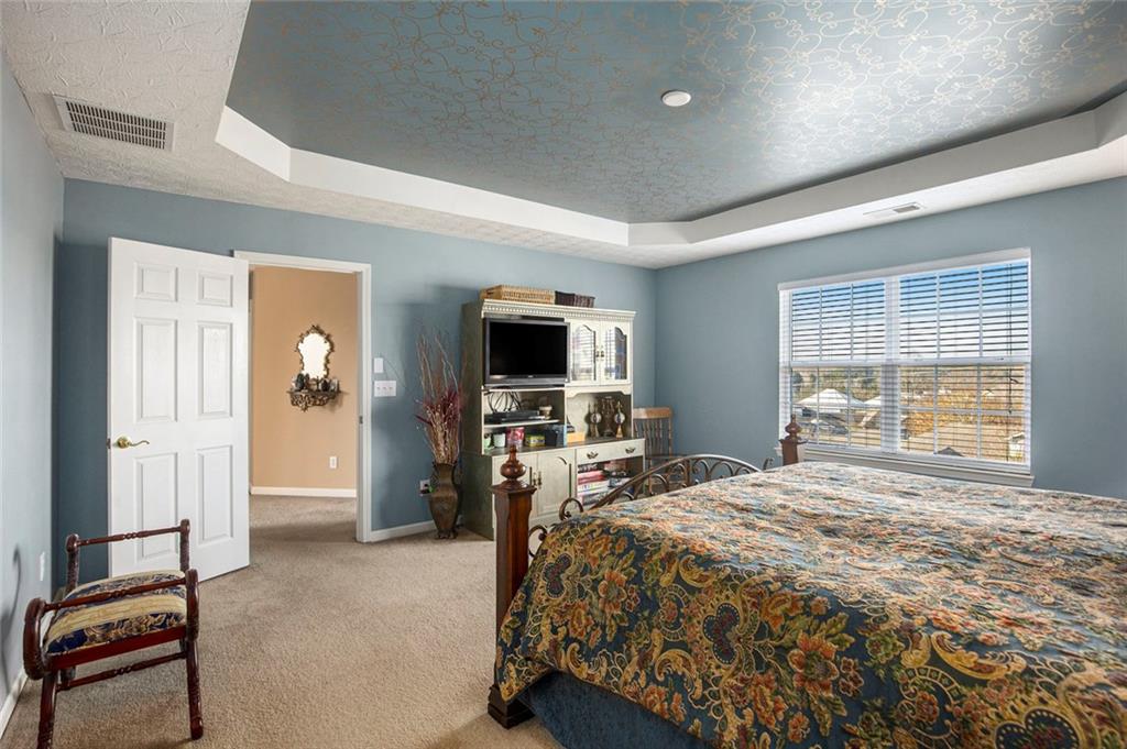 2054 Dartmoth Way Villa Rica, GA 30180 - Photo 21 of 45 a bedroom with a bed and a tv