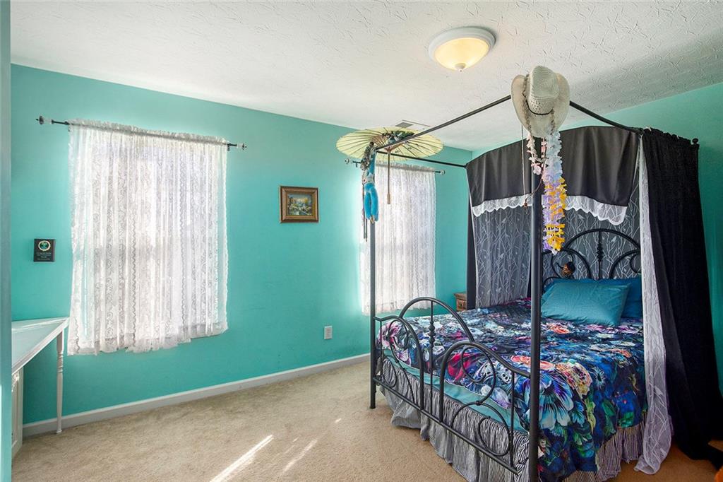 2054 Dartmoth Way Villa Rica, GA 30180 - Photo 25 of 45 a bedroom with bed and a window