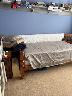 2054 Dartmoth Way Villa Rica, GA 30180 - Photo 28 of 45 a bed sitting in a bedroom next to a cabinet