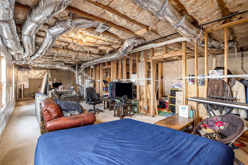 2054 Dartmoth Way Villa Rica, GA 30180 - Photo 29 of 45 a living room with furniture and a chandelier