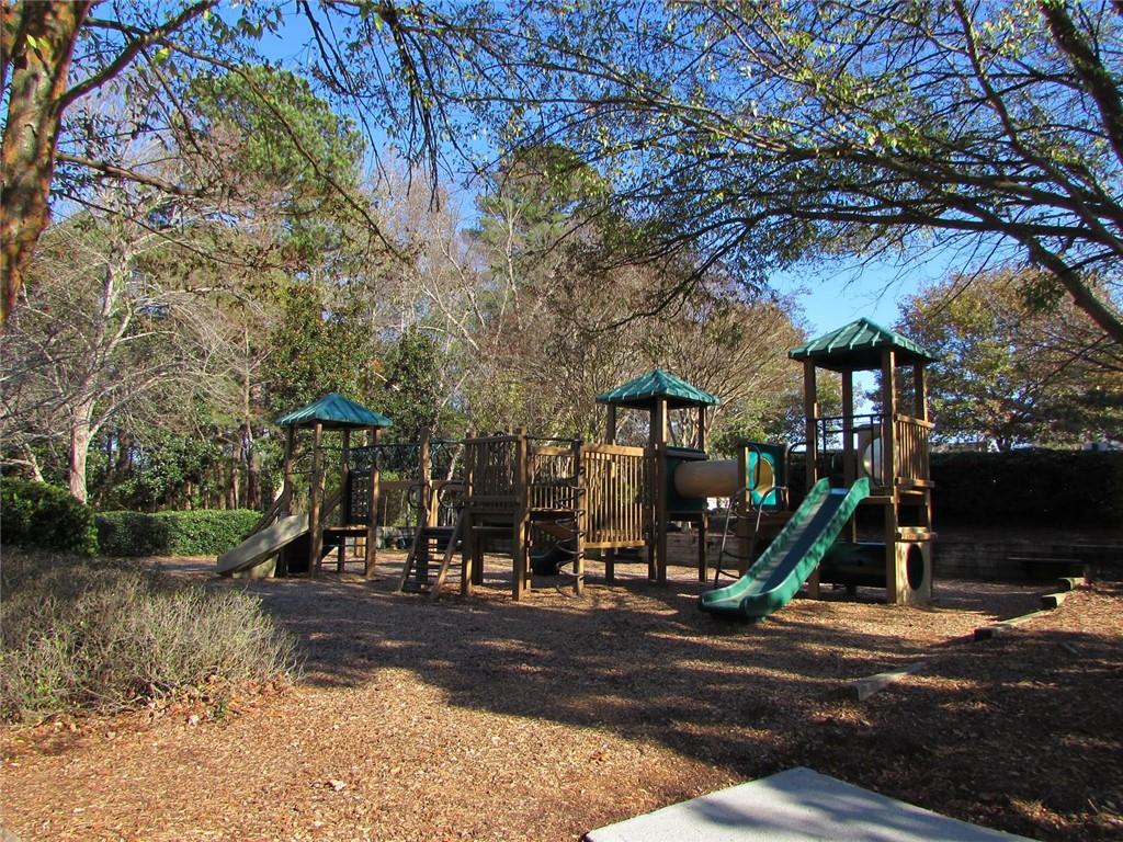 2054 Dartmoth Way Villa Rica, GA 30180 - Photo 42 of 45 a view of a park with swings and slides