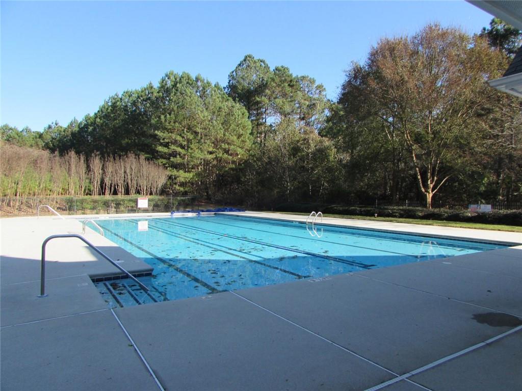 2054 Dartmoth Way Villa Rica, GA 30180 - Photo 44 of 45 a view of a swimming pool with a yard