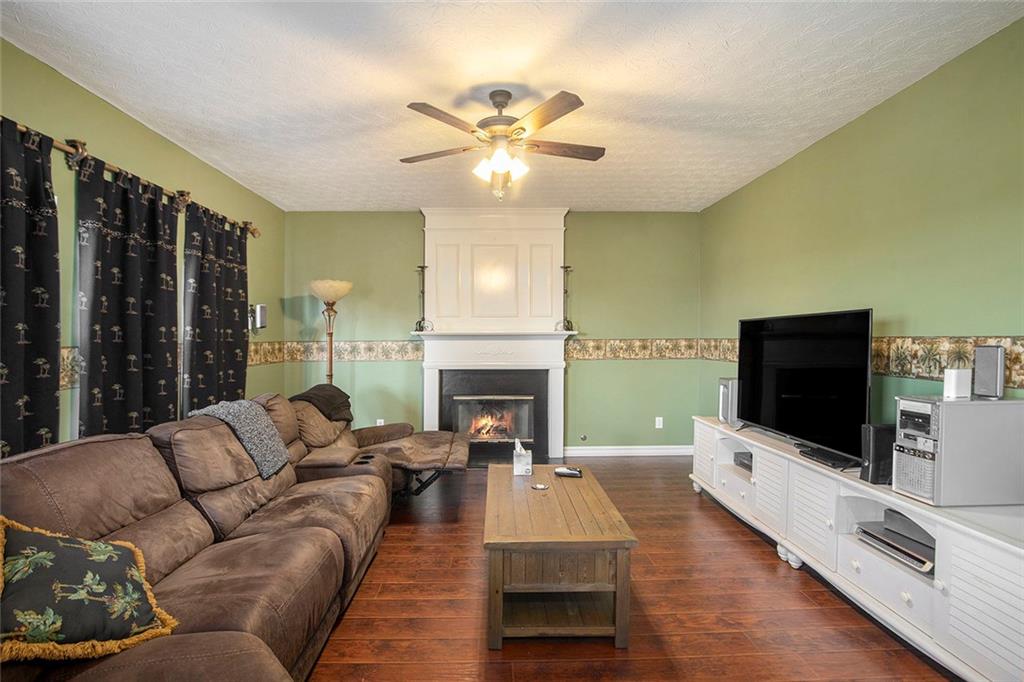 2054 Dartmoth Way Villa Rica, GA 30180 - Photo 5 of 45 a living room with furniture fireplace and flat screen tv