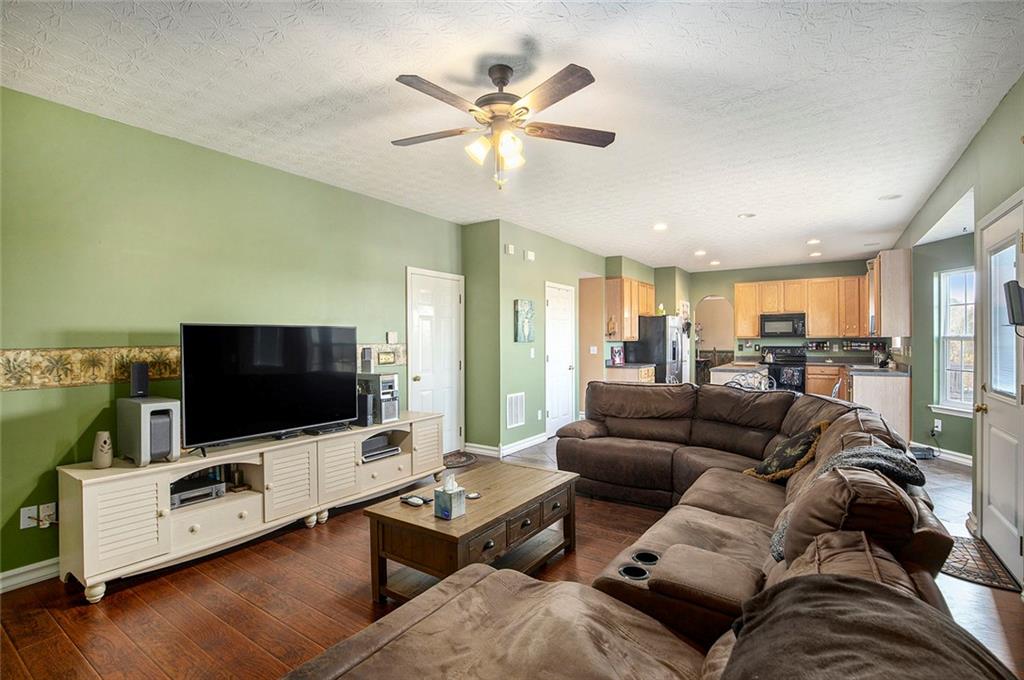 2054 Dartmoth Way Villa Rica, GA 30180 - Photo 8 of 45 a living room with furniture and a flat screen tv