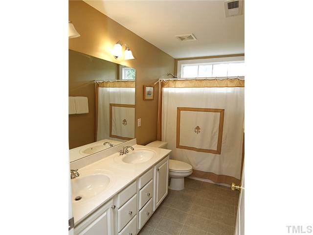 131 Forbes Road Wake Forest, NC 27587 - Photo 13 of 20 No fighting for sink time here...large double vanity gives kids or guests plenty of space to get ready. This bathroom also has tile floors and upgraded plumbing fixtures.