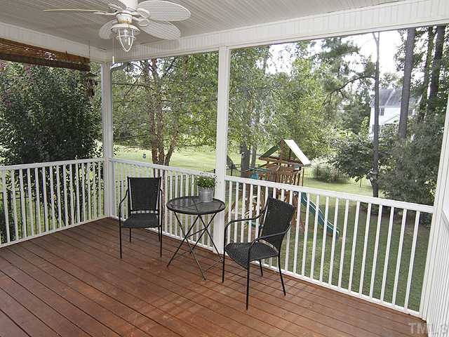 131 Forbes Road Wake Forest, NC 27587 - Photo 14 of 20 The screened porch is a great place to enjoy meals, visiting with friends, or watching the kids play in the back yard. Look at all of those lovely trees!