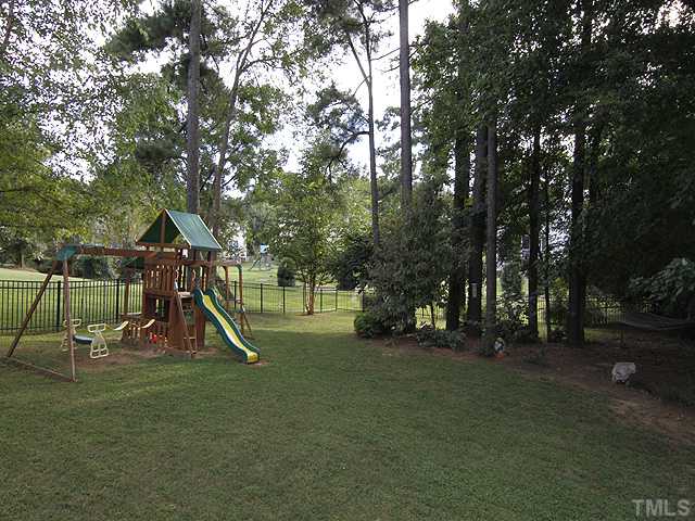 131 Forbes Road Wake Forest, NC 27587 - Photo 16 of 20 Great view of the fenced back yard. See the hammock between the trees on the right? This is a .25 acre lot but because of the neighborhood layout and how the back yards abut each other, it feels much larger.