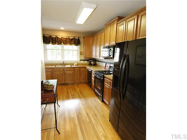 L-shaped kitchen has plenty of counter space for food prep, and plenty of cabinets.  Side by side refrigerator with ice and water in the door and dishwasher have recently been updated.  You will love the gas range and the built-in microwave!
