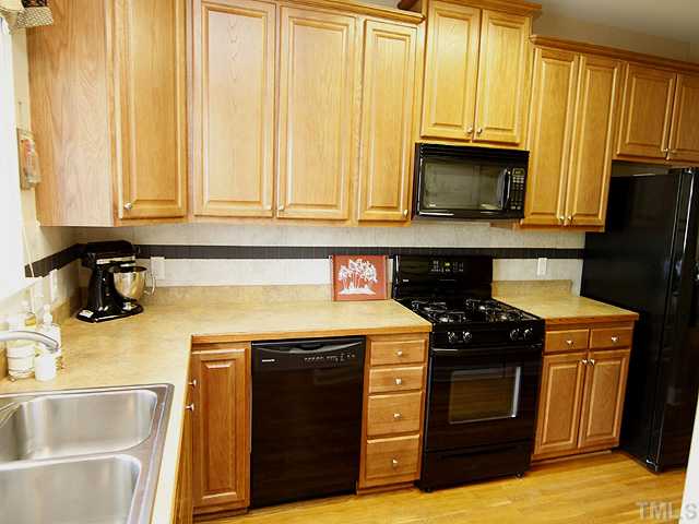 This kitchen has plenty of drawer storage, a corner lazy susan, and a custom tile backsplash.  Ample space for preparing meals or entertaining.