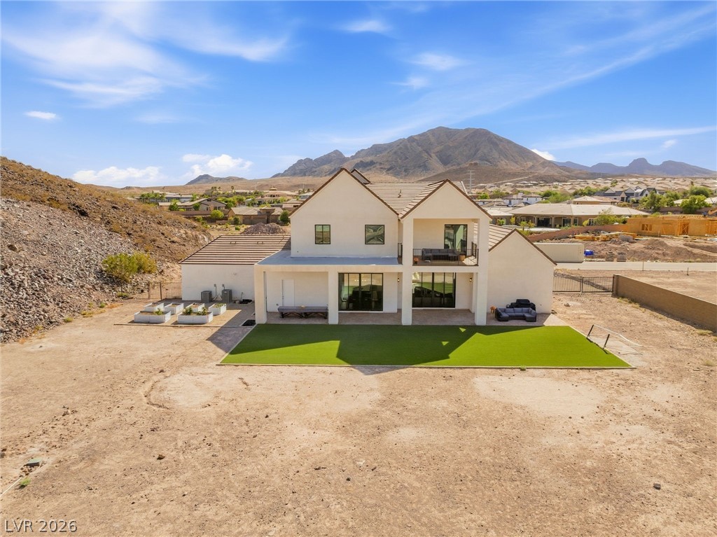 324 Wanda Road Henderson, NV 89002 - Photo 71 of 96 Dramatic mountain vistas provide a striking backdrop for this modern two-story desert residence.