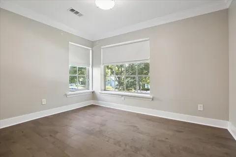 a bathroom with a granite countertop sink a potted plant and a shower