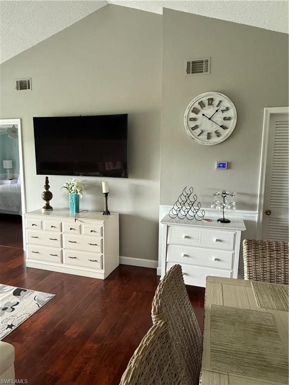 760 Augusta Boulevard, Unit D204 Naples, FL 34113 - Photo 24 of 32 a living room with furniture and a flat screen tv