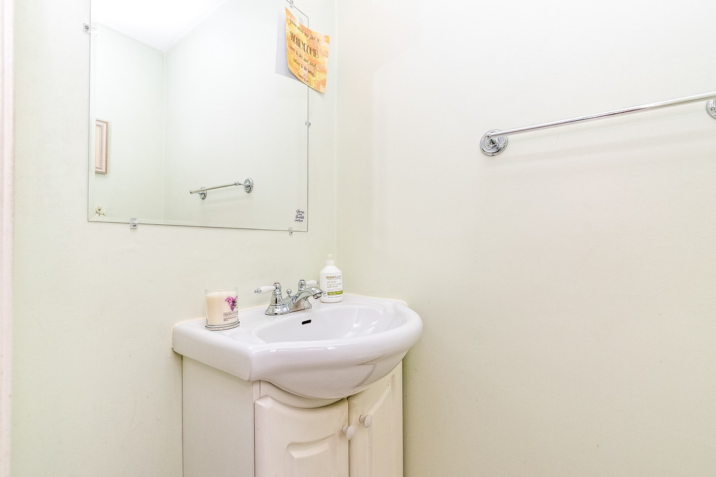424 Devonshire Court Bolingbrook, IL 60440 - Photo 6 of 16 a bathroom with a sink and a mirror