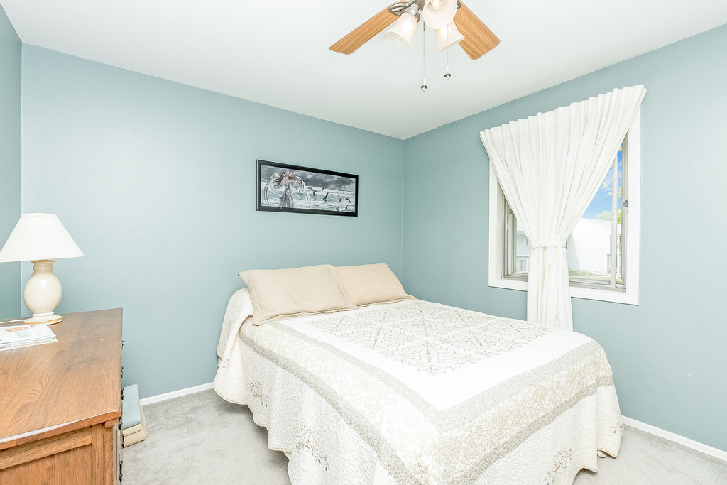 424 Devonshire Court Bolingbrook, IL 60440 - Photo 8 of 16 a bedroom with a bed and a window