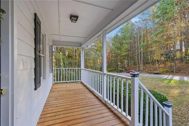 a view of a balcony with wooden floor