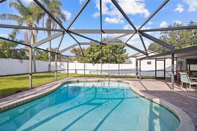 a view of a swimming pool with a patio