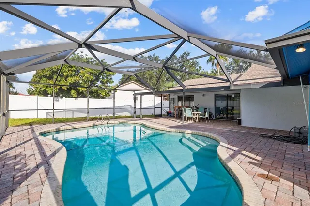 a view of a house with swimming pool
